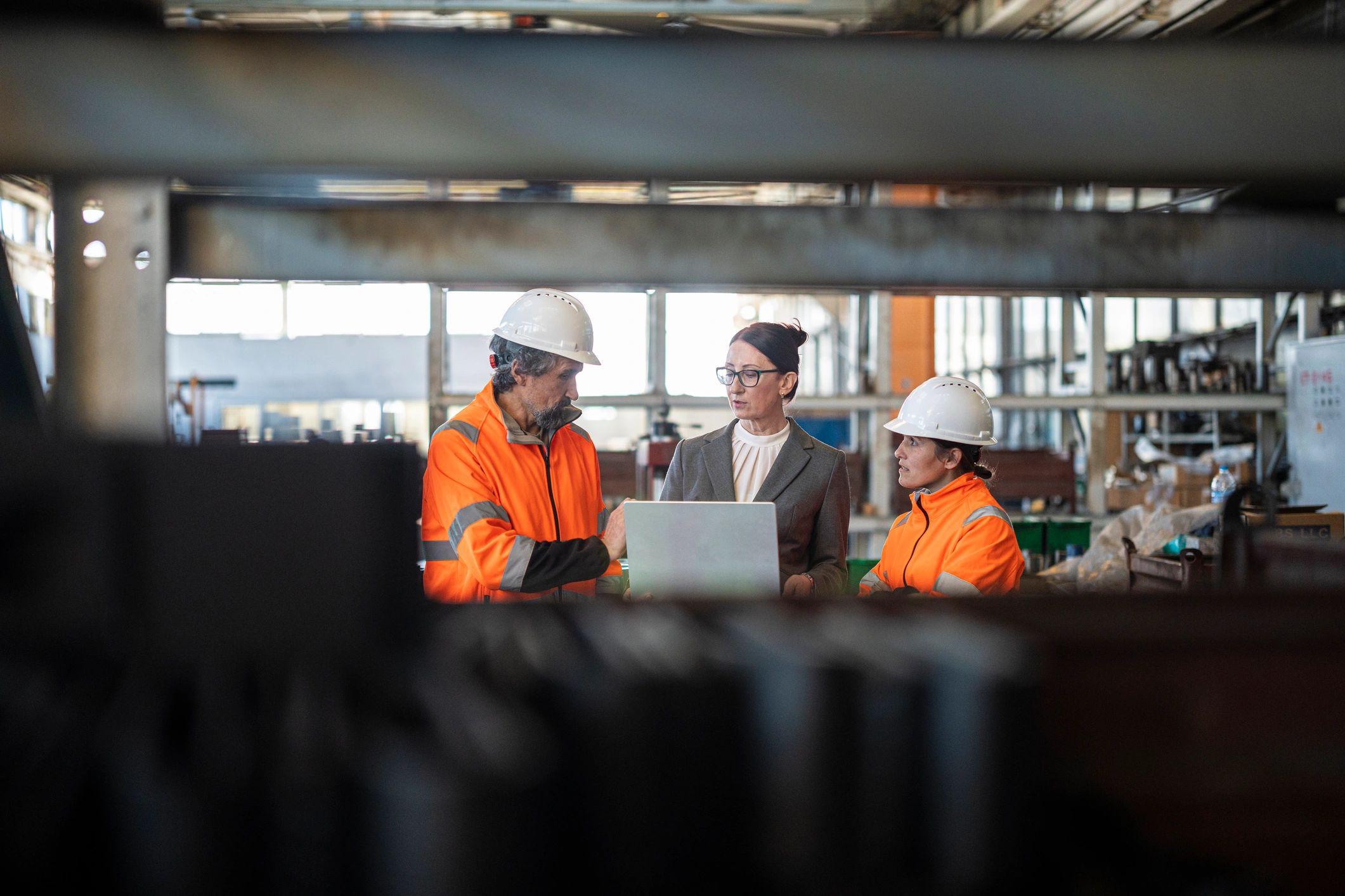 Factory team discussing operations on the shop floor