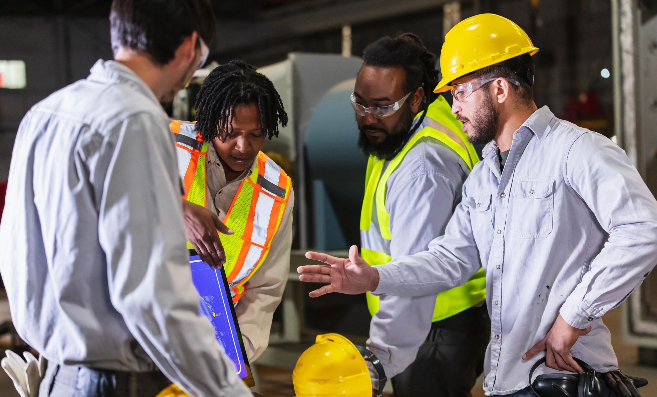 Engineers reviewing manufacturing data in a plant